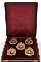 Lot 964 - A cased set of five enamelled photographic...