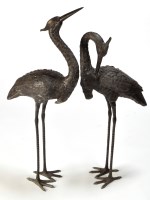 Lot 972 - A pair of patinated bronze stork ornaments,...