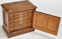 Lot 1013 - A 19th Century oak specimen coin cabinet, the...