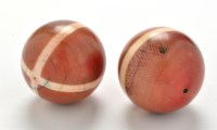 Lot 1025 - Two 19th Century stained ivory billiard balls,...