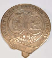 Lot 1054 - A brass casting of a GNER carriage shield,...