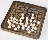 Lot 1057 - A 19th Century turned and stained ivory chess...