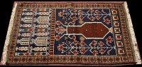 Lot 1247 - A Beluch prayer rug, decorated with a vase of...