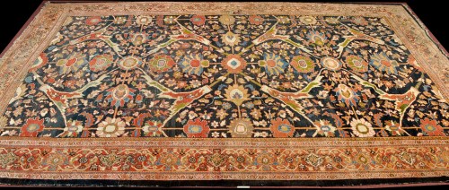 Lot 1251 - A large antique Ushak carpet, the blue field...