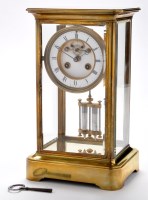Lot 1296 - A brass four glass mantel clock, late...