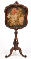 Lot 1307 - A Victorian carved walnut firescreen, the...