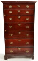 Lot 1311 - A late George III mahogany chest of seven long...