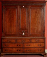 Lot 1313 - An 18th Century oak cupboard on chest, the...