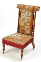 Lot 1325 - A Victorian rosewood prie dieu, upholstered in...