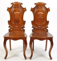 Lot 1342 - A pair of 19th Century oak hall chairs, the...