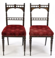 Lot 1345 - A pair of ebonised and parcel gilt occasional...