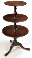 Lot 1348 - A late George III mahogany dumb waiter, the...