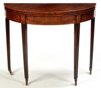 Lot 1360 - A George III mahogany demi lune turnover top...