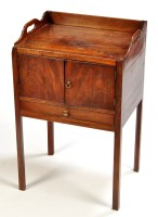 Lot 1363 - A George III mahogany pot cupboard, the three...