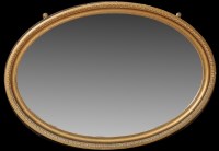 Lot 1372 - An early 20th Century oval wall mirror, the...