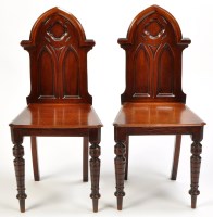 Lot 1383 - A pair of 19th Century mahogany hall chairs,...