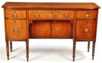 Lot 1398 - A late George III mahogany sideboard, the...