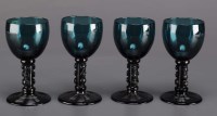 Lot 276 - Thirteen green drinking glasses, with...