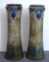 Lot 414 - Royal Doulton Lambeth: a pair of vases, with...