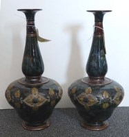 Lot 415 - Royal Doulton Lambeth: a pair of vases, with...