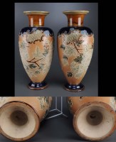 Lot 423 - A pair of Doulton Lambeth vases, typically...