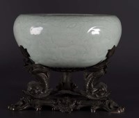 Lot 447 - A Ming Dynasty Celadon censer, carved in low...