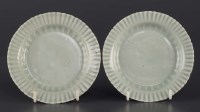 Lot 460 - A pair of carved Celadon saucer dishes, with...
