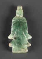 Lot 469 - A carved jade figure of Guanyin, the darker...