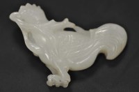 Lot 470 - A carved celadon jade model of a rooster...