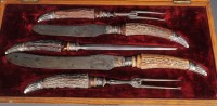 Lot 500 - A Victorian carving set, with antler handles,...