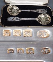Lot 546 - A pair of George V fruit serving spoons, by...