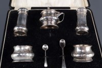 Lot 547 - A George V matched five-piece condiment sent,...