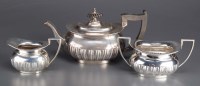 Lot 556 - A George V bachelor's three-piece tea service,...