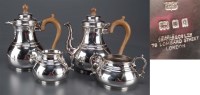 Lot 567 - A George V four-piece tea service, by Searle &...