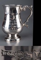 Lot 569 - An Elizabeth II mug, baluster-shaped, with...