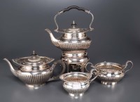 Lot 604 - An Edwardian four-piece tea service, by Walker...