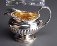 Lot 606 - A George III milk jug, by James McKay,...