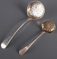Lot 634 - A George III sifting spoon, by I.L., London...