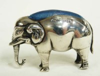 Lot 712 - An Edward VII elephant pattern pin cushion, by...