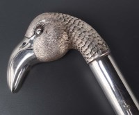 Lot 724 - An umbrella with silver flamingo head handle,...