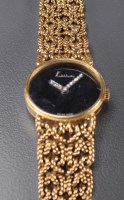 Lot 743 - Kutchinsky: a lady's 18k wristwatch, the black...