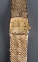 Lot 765 - Marvin Revue: a lady's 9ct. gold wristwatch,...