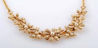 Lot 808 - A half pearl and gold necklace, c.1890, the...