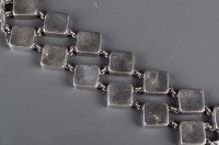 Lot 812 - Georg Jensen: a silver bracelet composed of...