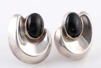 Lot 816 - A pair of silver and onyx earrings, the oval...