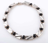 Lot 817 - A Mexican silver and onyx collar, composed of...