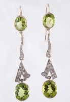 Lot 841 - A pair of peridot and diamond earrings, of...