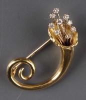 Lot 865 - A diamond and gold brooch modelled as a...