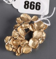 Lot 866 - A 9ct. gold brooch of polished and matte disks...