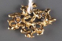 Lot 867 - An 18ct. two-tone gold brooch, the mount of...